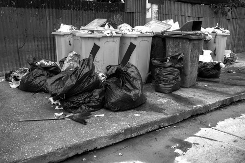 Waste collection trucks in Willesden streets